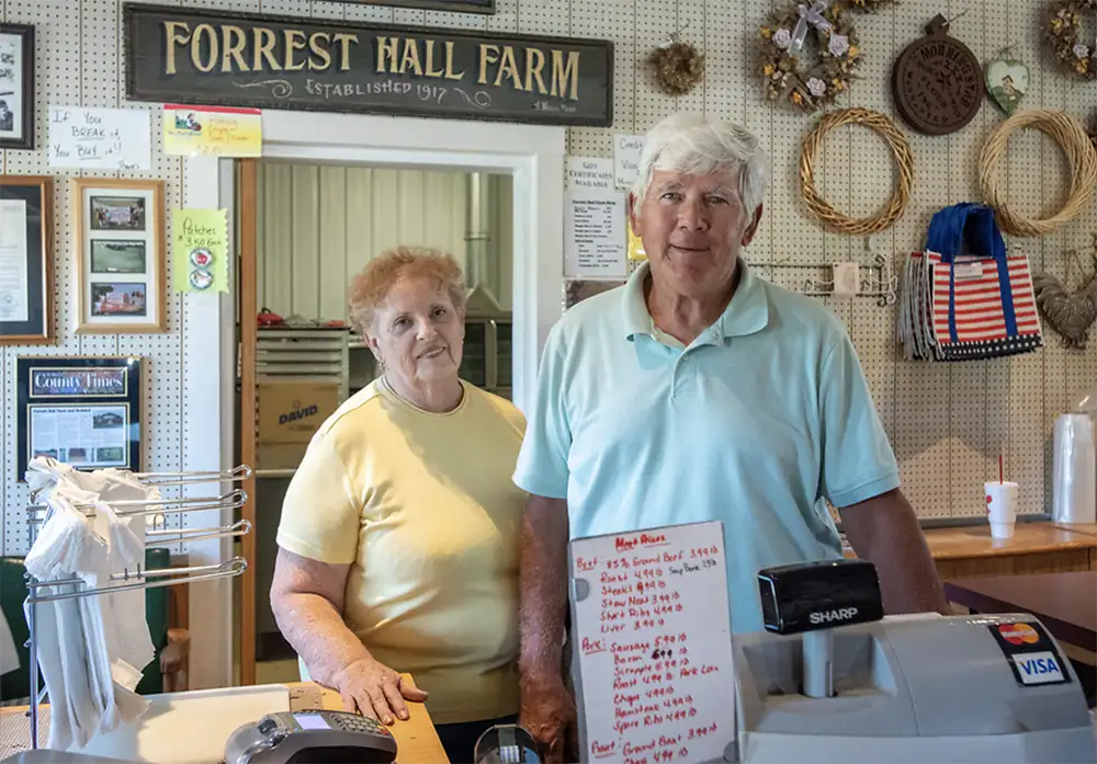 Proprietors behind the counter at Forrest Hill Farm store
